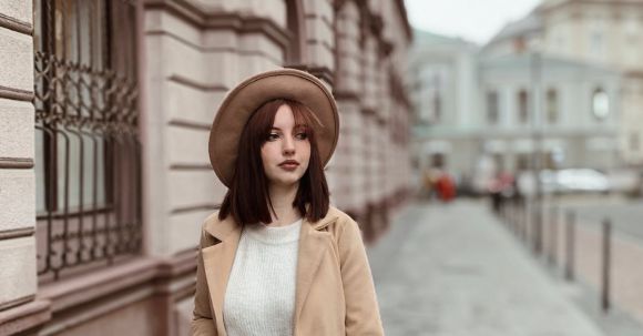 Fashion - Woman in Wearing A Brown Coat Walking On side walk