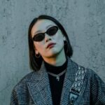 Fashion - Cool grunge lady in coat and sunglasses