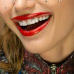 Trendy Accessories - Smiling Woman with Red Eyebrows
