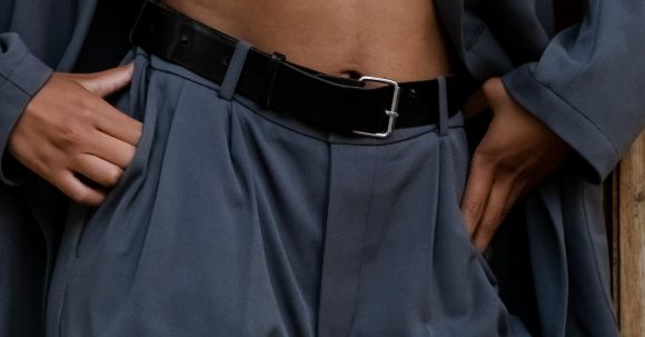 Fashion - Person in Gray Pants and Black Leather Belt