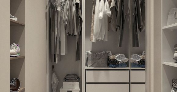 Wardrobe Essentials - Assorted Clothes Hanged Inside Cabinet