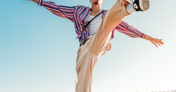 Fashion - Man Wearing White Pants with Left Foot Up